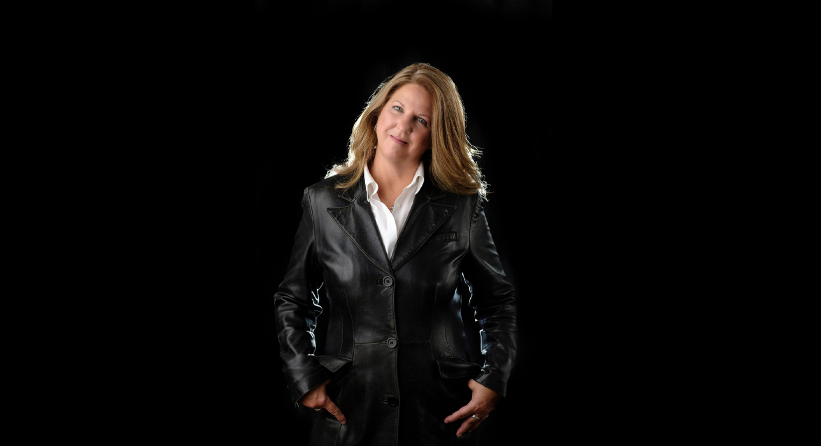 Proffesionaly shot image of Susan Rodgers in a black leather jacket.